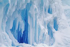 Melting Prints: Iceberg detail with blue hues showing ice and snow patterns during summer in Antarctica