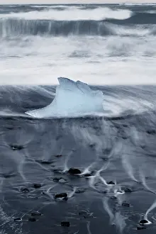 Glacial Prints: Iceberg or Growler shaped like a Glass Slipper on Fellsfjara Beach