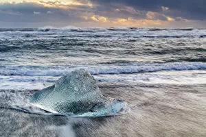 Lagoon Gallery: Iceberg from melting glacier on black sand beach near Jokulsarlon glacier lagoon