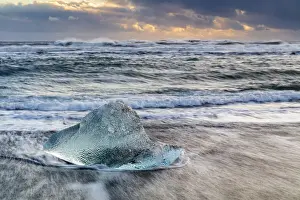 Lagoons Prints: Iceberg from melting glacier on black sand beach near Jokulsarlon glacier lagoon