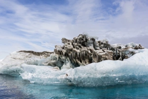 Iceberg with moraine material and icicles at Booth Island, Antarctica, Polar Regions