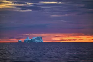 Arctic Circle Prints: Iceberg against orange sunset sky, Antarctica, Polar Regions