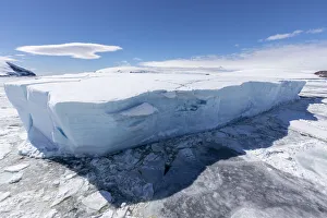 Weddel Sea Prints: Iceberg amongst winter sea ice breaking up in the Weddell Sea, Antarctica, Polar Regions