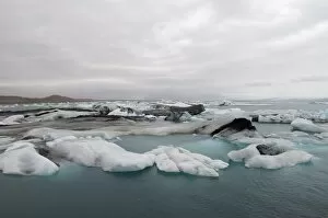 Icebergs floating in Jokulsarlon glacial lagoon, South coast, Iceland, Polar Regions