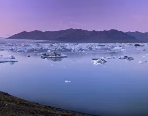 Icebergs in Jokulsarlon glacial lagoon, at sunset, Breidamerkurjokull