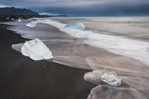 Volcanic Sand Prints: Icebergs at sunrise on Jokulsarlon Beach