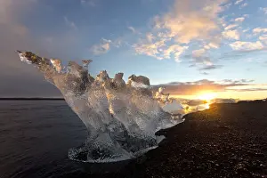 Icebergs at sunset on Jokulsa Beach, on the edge of the Vatnajokull National Park, South Iceland, Iceland, Polar Regions