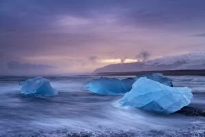 Icebergs washed ashore on Breidamerkursandur black sands, near Jokulsarlon glacial lagoon