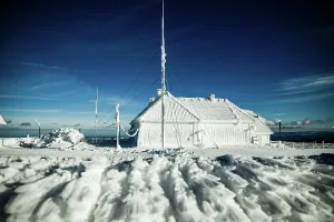 Romania Prints: Icicles form on structures in a frozen landscape during winter in Romania