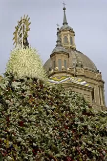 The icon of Nuestra Senora del Pilar covered in flowers