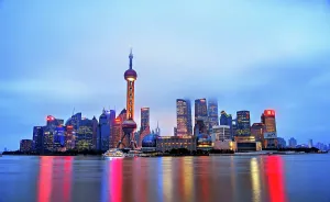 Skyscrapers Prints: The iconic Lujiazui skyline shrouded in fog at dusk