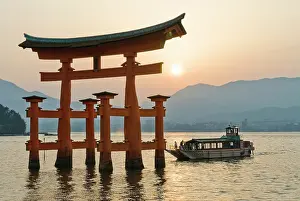 Cruise Prints: The iconic torii and a tourist cruise boatat the Itsukushima Shrine