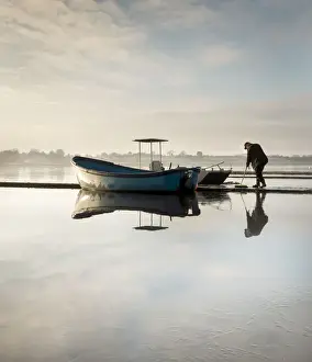Preparation Prints: A very icy cold morning on Hornsea Mere as the boats and jetty are prepared for