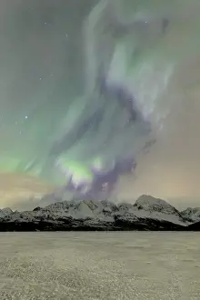Polar Aurorae Prints: The icy lake of Jaegervatnet framed by the Northern Lights (aurora borealis)