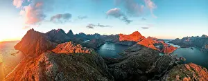 Moskenesoya Prints: Idyllic lake framed by mountains overlooking the arctic sea at sunset
