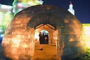 Illuminating Prints: An igloo ice sculpture illuminated at night at the Ice Lantern Festival