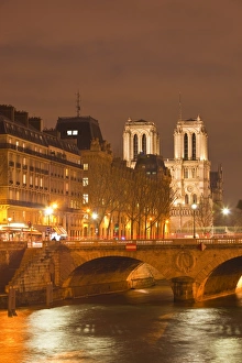 Ile De La Cite Prints: The Ile de la Cite and Notre Dame cathedral at night, Paris, France, Europe