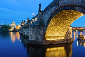 Night Sky Prints: Illuminated arch of Charles Bridge at twilight