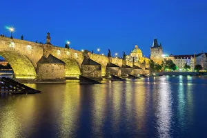 Mala Strana Prints: Illuminated Charles Bridge with reflections at twilight