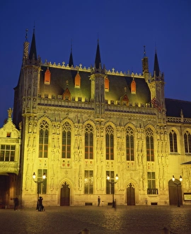 Brugge Prints: The illuminated facade of the Town Hall in Burg Square in Bruges, at night