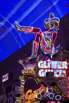 Illuminated girl on sign at Glitter Gulch, Fremont Street, Las Vegas, Nevada