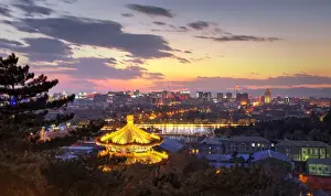 Beijing Prints: Illuminated pagoda and view towards the western part of Beijing city at nightfall