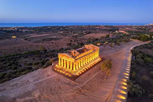 Ancient Greece Prints: The illuminated Temple of Concordia seen from a drone at dawn