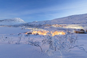 Illuminated village of Riksgransen at dusk, Abisko, Kiruna Municipality, Norrbotten County