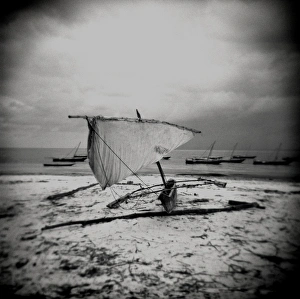 Monochrome Gallery: Image taken with a Holga medium format 120 film toy camera of dhow on beach in stormy weather
