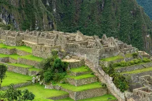 Trail Prints: Inca site of Machu Picchu shows ancient architecture and terraced fields in Peru