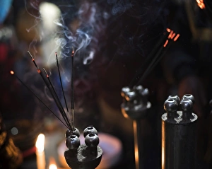 Foreground Focus Prints: Incense burning at a Hindu temple in New Delhi, India, Asia