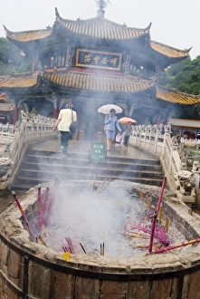 Stick Prints: Incense sticks burning in front of Yuantong Temple, Kunming, Yunnan, China, Asia