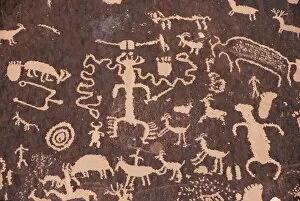 Sandstone Gallery: Indian petroglyphs drawn on red standstone by scratching