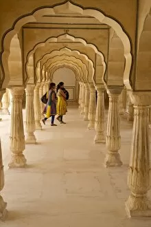 Fortification Gallery: Indian women under arches, Amber Fort Palace, Jaipur, Rajasthan, India, Asia