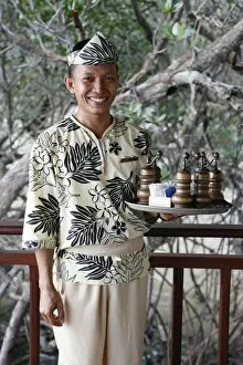 Indonesian waiter at the Banyan Tree hotel, Bintan, Indonesia, Southeast Asia, Asia