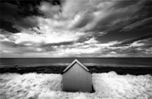 Infrared image of hut in dunes overlooking the North Sea, Bamburgh, Northumberland Infrared image of hut in dunes overlooking the North Sea, Bamburgh, Northumberland