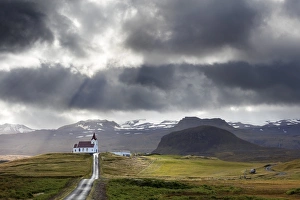 Snaefellsnes Peninsula Gallery: Ingjaldsholskirkja set against mountains on a dramatic stormy day, near Rif, Snaefellsnes Peninsula