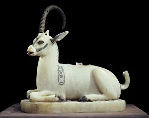 Inlaid alabaster unguent jar in the form of an ibex, with one natural horn