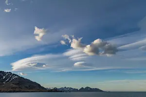 Spectacle Prints: Interesting lenticular cloud formations forming over the island of South Georgia in the Southern Ocean