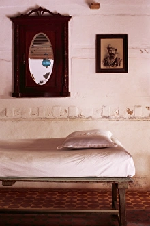 Looking Glass Prints: Interior detail of day bed with old photograph of a