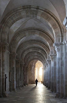Nave Prints: Interior north nave aisle with priest walking away