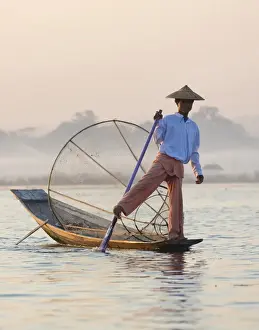 Conical Hat Prints: Intha leg rowing fishermen at dawn on Inle Lake who row traditional wooden boats using their leg