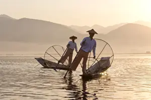 Conical Hat Prints: Intha leg rowing fishermen at sunset on Inle Lake who row traditional wooden boats using their leg