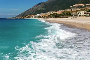 Albania Prints: Ionian Sea, Drymades Beach, with large scale tourist development construction building work in the distance