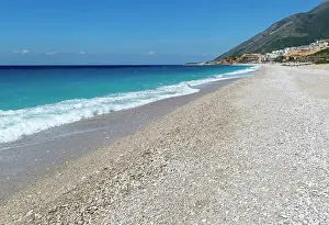 Albania Prints: Ionian Sea, Drymades Beach, with large scale tourist development construction building work in the distance