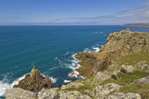 The Irish Lady Rock under Mayon cliff with Pedn-men-du headland and coastguard lookout in the distance, near Sennen Cove, Cornwall, England, United