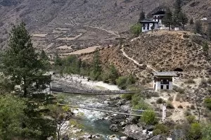 Iron bridge in valley, Bhutan, Asia