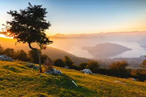 Brescia Province Prints: Iseo Lake and Monte Isola at sunset with fog in autumn season, Brescia Province, Lombardy