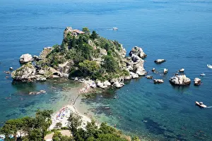 Taormina Prints: Isola Bella beach offers sun and leisure with clear water and boat access in Taormina