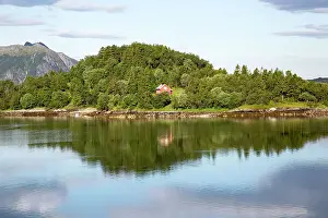 Secluded Prints: Isolated coastal house on small wooded island near Ornes